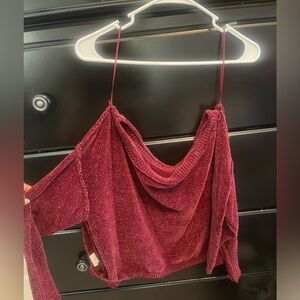 Off the shoulder red velvet sweater.